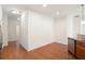 Hallway featuring hardwood floors that connects the kitchen to other areas of the home at 2061 Grove Field Lane #13, Marietta, GA 30064
