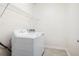 Laundry room features a washer and dryer with wire shelving above at 2061 Grove Field Lane #13, Marietta, GA 30064