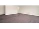 An empty living room with carpet and neutral walls at 2061 Grove Field Lane #13, Marietta, GA 30064