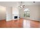 Open living room with fireplace, built-in shelving, and a large window at 2061 Grove Field Lane #13, Marietta, GA 30064