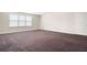 Spacious living room with plush carpet and a large window for natural light at 2061 Grove Field Lane #13, Marietta, GA 30064