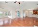 Bright, open living room with hardwood floors, view of sunroom, and blue front door at 2061 Grove Field Lane #13, Marietta, GA 30064
