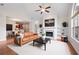 Bright living room with a fireplace, built-in bookshelves, and a tan leather sofa at 2061 Grove Field Lane #13, Marietta, GA 30064