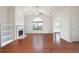 Living room featuring hardwood floors, vaulted ceilings, and fireplace with built-ins at 2061 Grove Field Lane #13, Marietta, GA 30064