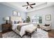 Comfortable main bedroom with neutral colors, tray ceiling, and a large window at 2061 Grove Field Lane #13, Marietta, GA 30064