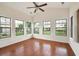 Charming sunroom with a ceiling fan, vaulted ceiling, and multiple windows providing abundant natural light at 2061 Grove Field Lane #13, Marietta, GA 30064