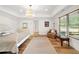 Bright bedroom features hardwood floors, white trim, recessed lights and light-colored walls and modern furnishings at 3925 Sheldon Ne Dr, Atlanta, GA 30342