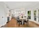 Bright breakfast nook featuring a round wooden table, white walls and views of the outside deck at 3925 Sheldon Ne Dr, Atlanta, GA 30342