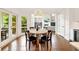 Bright breakfast nook featuring a round wooden table, wood floors and views of the outside deck at 3925 Sheldon Ne Dr, Atlanta, GA 30342