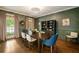 Sophisticated dining room with wainscoting, elegant lighting, and oversized windows at 3925 Sheldon Ne Dr, Atlanta, GA 30342