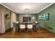 Beautiful dining room with decorative lighting, elegant paint, and a large table with seating at 3925 Sheldon Ne Dr, Atlanta, GA 30342