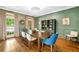 Bright and airy dining room featuring hardwood floors, modern decor and a window to the outdoors at 3925 Sheldon Ne Dr, Atlanta, GA 30342