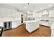 Spacious kitchen with large island, stainless steel appliances and abundant white cabinetry at 3925 Sheldon Ne Dr, Atlanta, GA 30342