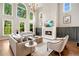 Sun-drenched living room boasting soaring ceilings, a modern fireplace, and stunning picture windows at 3925 Sheldon Ne Dr, Atlanta, GA 30342
