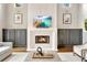 Modern living room showcasing built-in cabinetry, a stylish fireplace, and views of the outdoors at 3925 Sheldon Ne Dr, Atlanta, GA 30342
