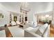 Spacious living room with hardwood floors, soaring ceilings, and seamless flow to other living spaces at 3925 Sheldon Ne Dr, Atlanta, GA 30342