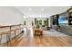 Open-concept living room features built-in cabinets, large windows, and a view to the back yard at 3925 Sheldon Ne Dr, Atlanta, GA 30342