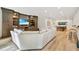 Bright living room showcasing built-in shelving and entertainment center alongside an adjacent game area at 3925 Sheldon Ne Dr, Atlanta, GA 30342