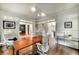 Spacious home office with hardwood floors, grey cabinets, and ample natural light at 3925 Sheldon Ne Dr, Atlanta, GA 30342