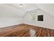 This bedroom offers wood flooring, and a window that provides natural light at 2089 College Ne Ave, Atlanta, GA 30317