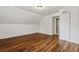 This bedroom boasts wood flooring, natural light, and a closet for storage at 2089 College Ne Ave, Atlanta, GA 30317