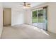 Bedroom features include a ceiling fan, carpet, sliding glass door, and closet at 509 Woodland Ln, Lawrenceville, GA 30043
