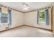 Inviting bedroom with two large windows and natural light at 509 Woodland Ln, Lawrenceville, GA 30043
