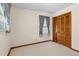 Bedroom featuring a large closet and a window at 509 Woodland Ln, Lawrenceville, GA 30043