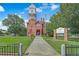 Gwinnett Historic Courthouse exterior featuring a clock tower and well-manicured lawn at 509 Woodland Ln, Lawrenceville, GA 30043
