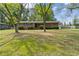 Charming brick home with green shutters and mature landscaping in a desirable neighborhood at 509 Woodland Ln, Lawrenceville, GA 30043