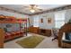 This bedroom features a bunk bed, a piano, and plenty of space at 569 Hale Mountain Ct, Hiram, GA 30141