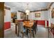 Dining room showcasing chandelier, chair rail, and view into kitchen at 569 Hale Mountain Ct, Hiram, GA 30141
