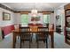 Formal dining room with chandelier and view to backyard at 569 Hale Mountain Ct, Hiram, GA 30141