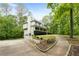 Charming home featuring a covered front porch, manicured landscaping, and a two-car garage at 569 Hale Mountain Ct, Hiram, GA 30141