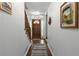 Open foyer with views of the stairs and front door and a decorative runner on the floor at 569 Hale Mountain Ct, Hiram, GA 30141