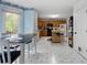 Eat-in kitchen featuring wood cabinets, black appliances, and natural light at 569 Hale Mountain Ct, Hiram, GA 30141