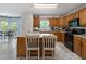 Eat-in kitchen showcasing wood cabinets, black appliances, and breakfast area at 569 Hale Mountain Ct, Hiram, GA 30141