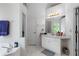 Bright bathroom featuring a vanity, a tub, and a separate toilet room at 569 Hale Mountain Ct, Hiram, GA 30141