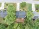 Aerial view of house with well-manicured lawn, mature trees and small deck at 115 Blue Ridge Trl, Powder Springs, GA 30127