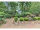 Backyard with a well-manicured lawn and lush landscaping at 115 Blue Ridge Trl, Powder Springs, GA 30127