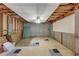 Unfinished basement with concrete walls, open ceiling, and flooring squares; ready for customization at 115 Blue Ridge Trl, Powder Springs, GA 30127