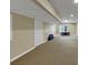 Spacious unfinished basement featuring neutral walls, carpeting, and potential for customization at 115 Blue Ridge Trl, Powder Springs, GA 30127