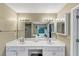 Bathroom featuring dual sinks, ample counter space, and storage cabinets at 115 Blue Ridge Trl, Powder Springs, GA 30127