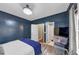 Bedroom featuring a bed, TV, access to a bathroom, and lots of natural light at 115 Blue Ridge Trl, Powder Springs, GA 30127