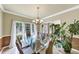 Bright dining room with tile floors and large windows at 115 Blue Ridge Trl, Powder Springs, GA 30127