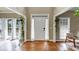 Bright foyer featuring hardwood floors, natural light and a modern chair with curtains at 115 Blue Ridge Trl, Powder Springs, GA 30127