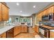 Spacious kitchen with hardwood floors, stainless appliances, and a breakfast nook with bright natural light at 115 Blue Ridge Trl, Powder Springs, GA 30127