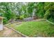 Backyard featuring a grassy area and partial fence at 2923 Bicentennial Dr, Stone Mountain, GA 30087