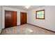 Bright bedroom with two closets and a window at 2923 Bicentennial Dr, Stone Mountain, GA 30087