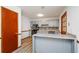 Modern kitchen with gray cabinets, granite countertops, mosaic backsplash, and stainless steel appliances at 2923 Bicentennial Dr, Stone Mountain, GA 30087